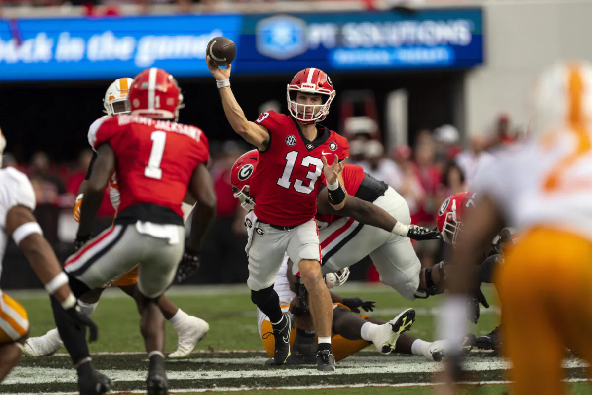 Georgia quarterback Stetson Bennett (13) throws from the pocket during the first half of an NCAA college football game against Tennessee, in Athens, Ga., on Nov. 5, 2022. (John Bazemore/AP Photo)