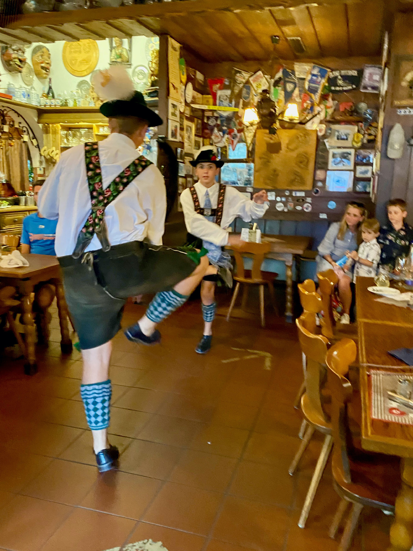 Young men perform traditional schuhplattler folk dances in Ludwigstrasse in the Gasthof Fraundorfer in Garmisch-Partenkirchen, Germany.
