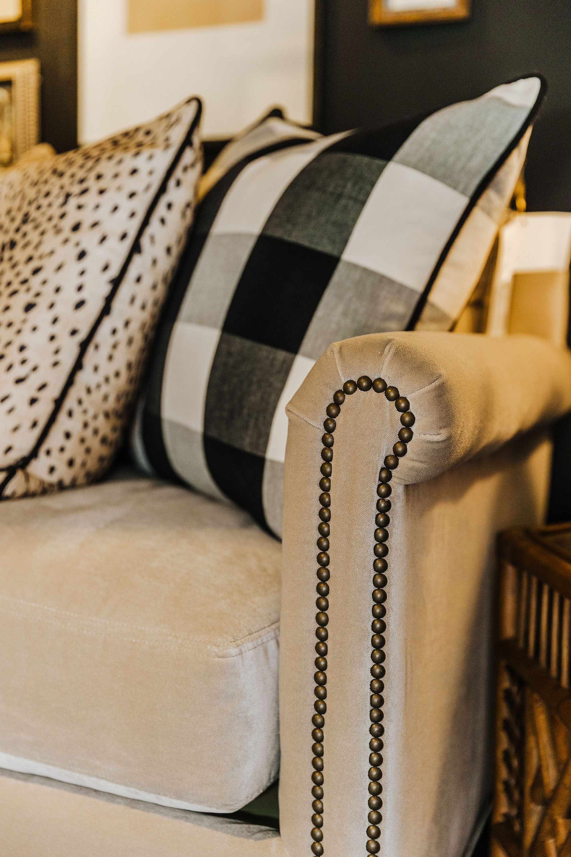 A hammered nail detail adds a sophisticated flair to this velvet sofa.