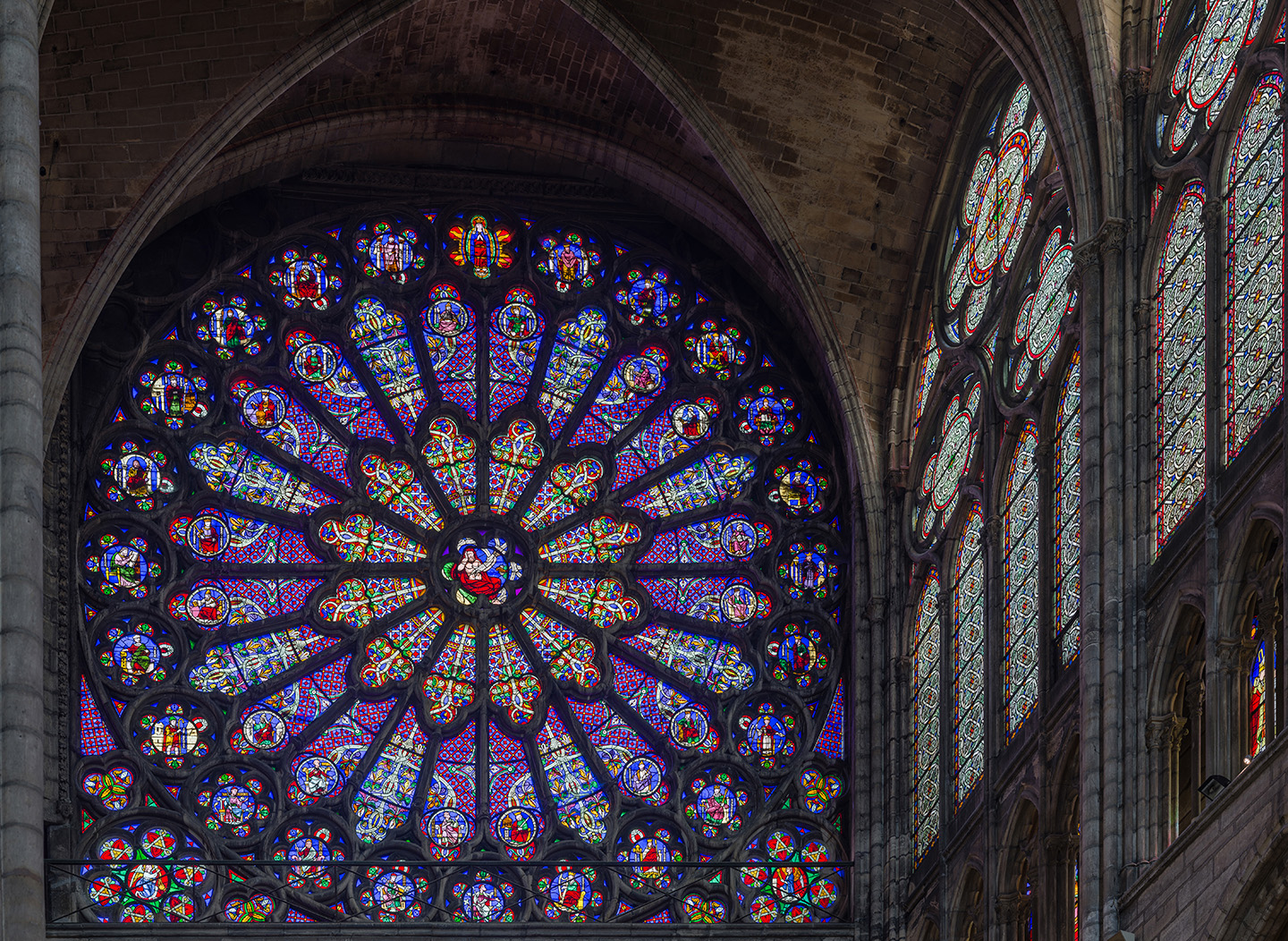 Stained glass rose window of the north transept in the Abbey of St. Denis, France.