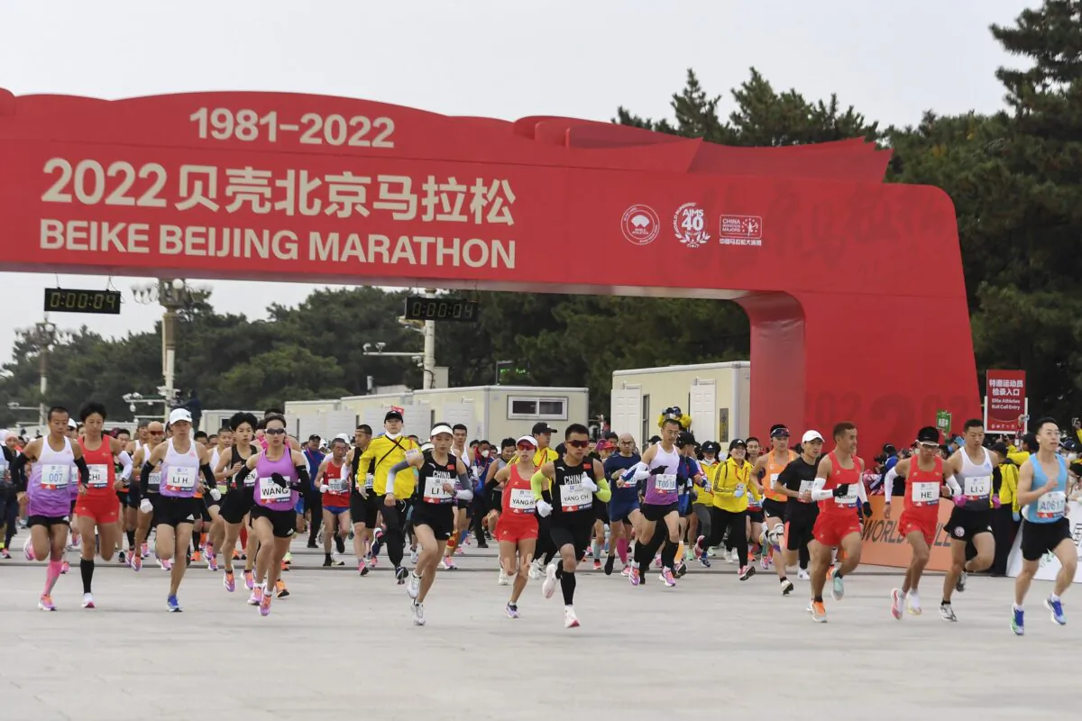 Runners start to compete in the Beijing Marathon in Beijing on Nov. 6, 2022. (Zhang Chenlin/Xinhua via AP)
