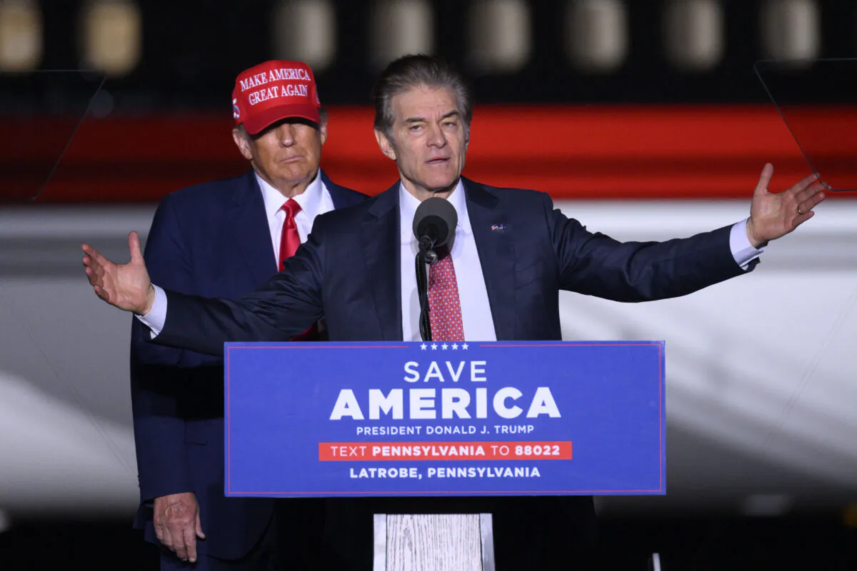 Former President Donald Trump (L) looks on as Republican Senatorial candidate Mehmet Oz speaks during a "Save America" rally ahead of the midterm elections at Arnold Palmer Regional Airport in Latrobe, Pa., on Nov. 5, 2022. (Angela Weiss/AFP via Getty Images)