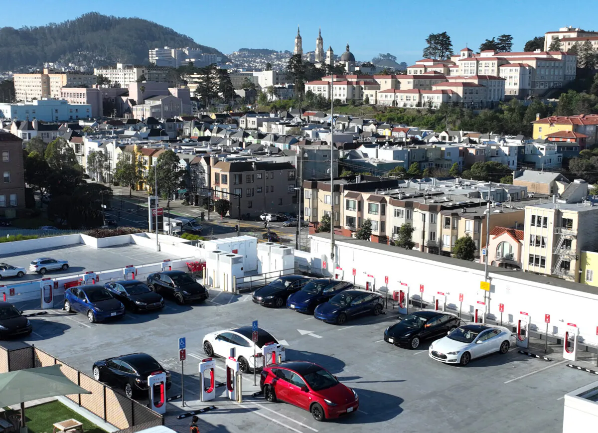 Tesla cars recharge their batteries at the Geary Boulevard Supercharger in San Francisco on March 9, 2022. (Photo by Justin Sullivan/Getty Images)