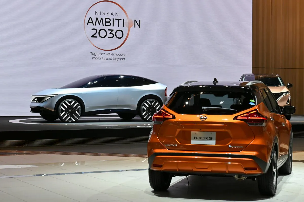 Nissan Motor's electric vehicle (EV) concept car (L) is displayed at the company's showroom in Yokohama on Nov. 29, 2021. (KAZUHIRO NOGI/AFP via Getty Images)