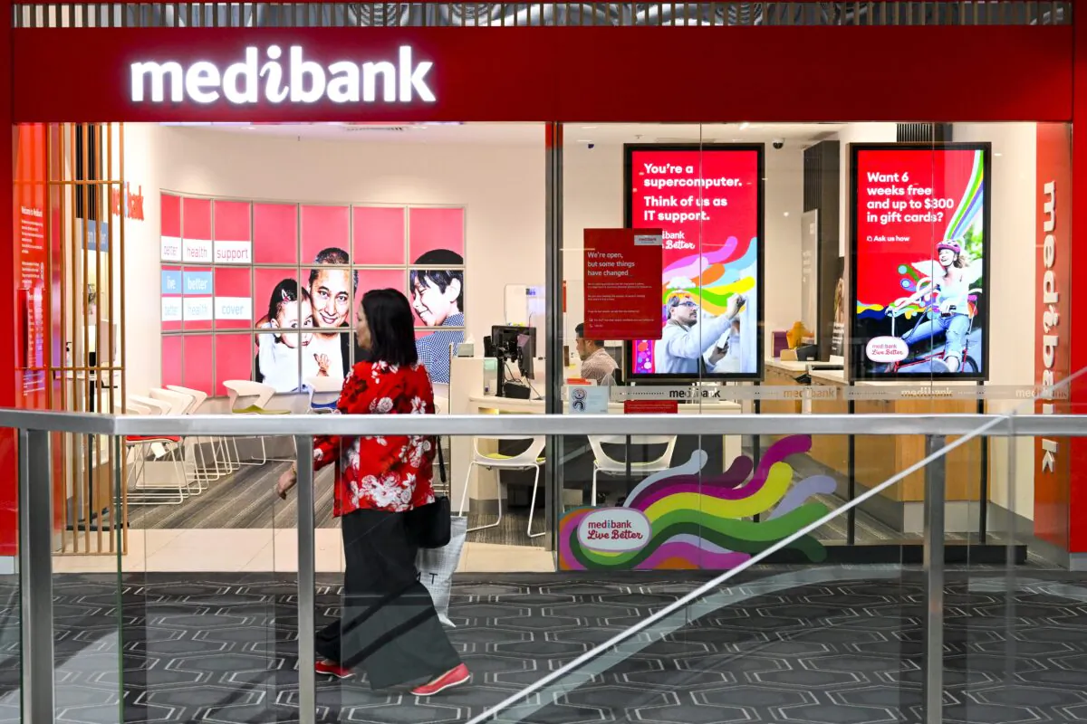 A woman walks past a ‘medibank’ shopfront in Canberra, Australia, on Oct. 20, 2022. (AAP Image/Lukas Coch)