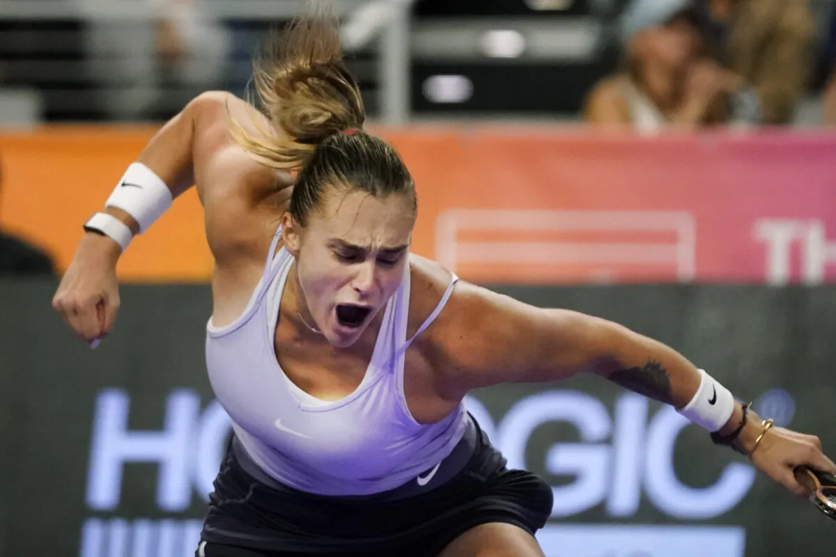 Aryna Sabalenka of Belarus reacts to winning the second set and match against Iga Swiatek of Poland in the singles semifinals of the WTA Finals tennis tournament in Fort Worth, Texas, on Nov. 6, 2022. (LM Otero/AP Photo)