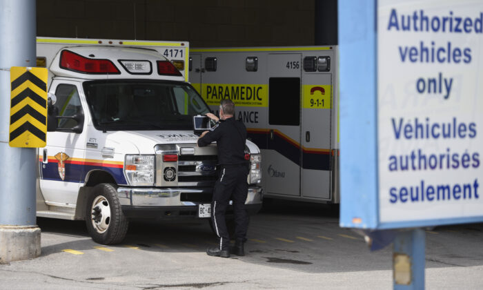 Ambulances parked outside of a hospital in Ottawa in a file photo. (The Canadian Press/Justin Tang)