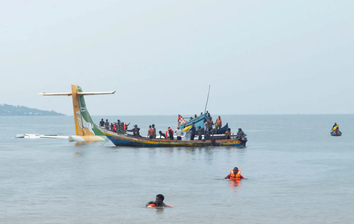 Rescuers attempt to recover the Precision Air passenger plane that crashed into Lake Victoria in Bukoba, Tanzania, on Nov. 6, 2022. (Stringer/Reuters)