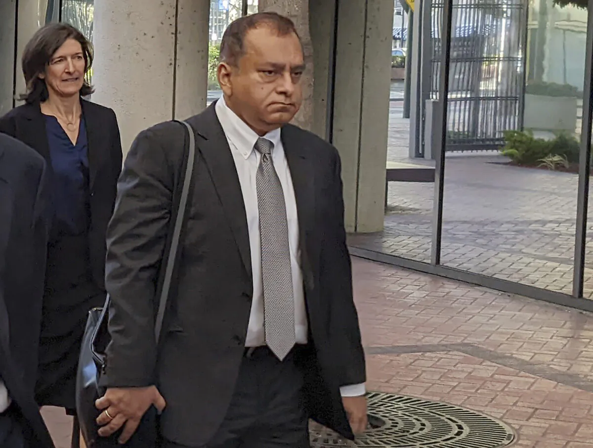 Ramesh "Sunny" Balwani (R), the former lover and business partner of Theranos CEO Elizabeth Holmes, walks into federal court in San Jose, Calif., on June 24, 2022. (Michael Liedtke/AP Photo)