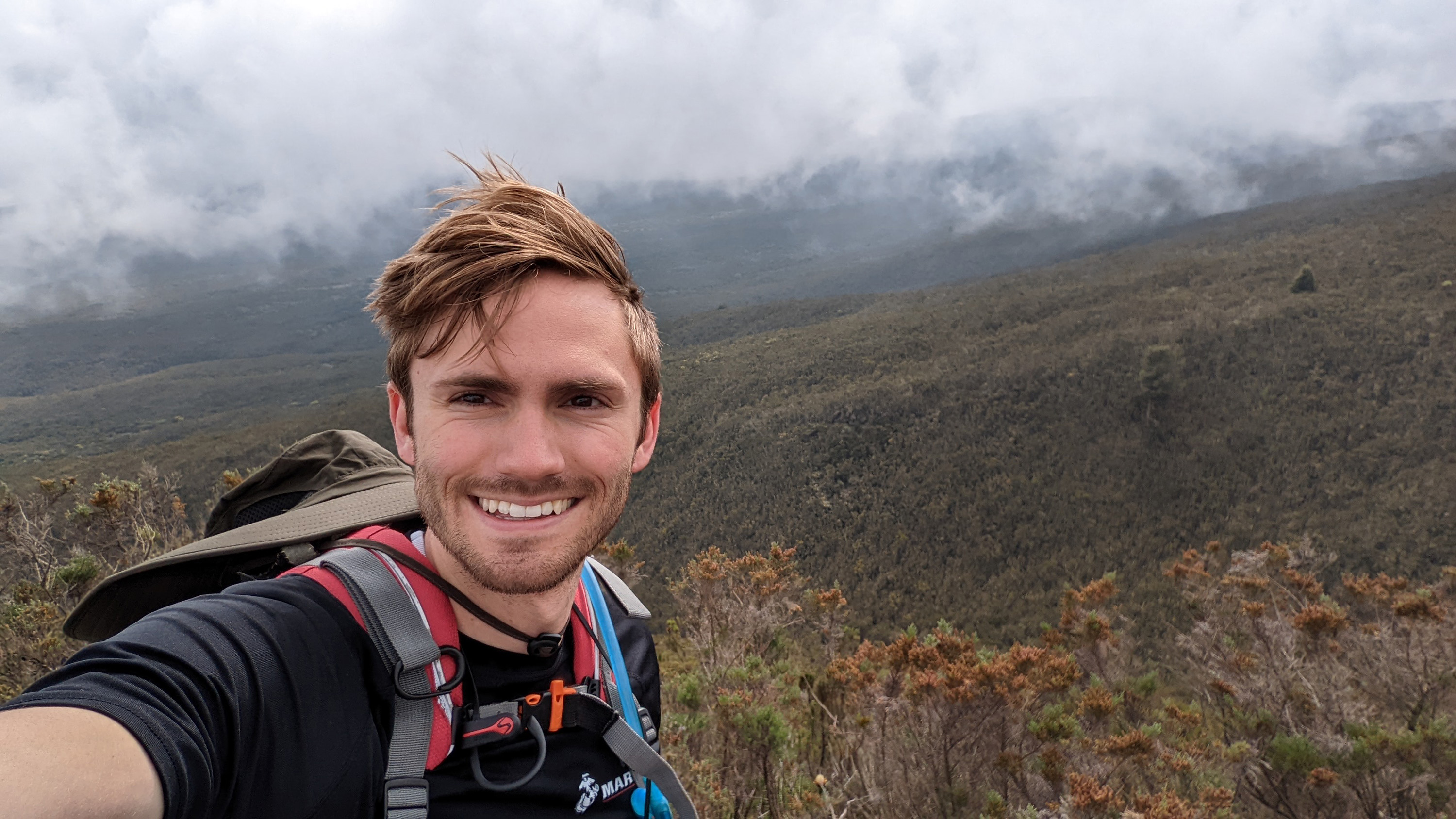 Tim Ballard, 25, instigator of his family's African adventure trip, takes a selfie while on a break from hiking in the moorlands section of Mount Kilimanjaro.