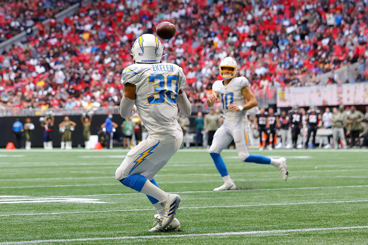 Austin Ekeler (30) of the Los Angeles Chargers scores a touchdown during the second quarter in the game against the Atlanta Falcons at Mercedes-Benz Stadium in Atlanta, on Nov. 6, 2022. (Todd Kirkland/Getty Images)