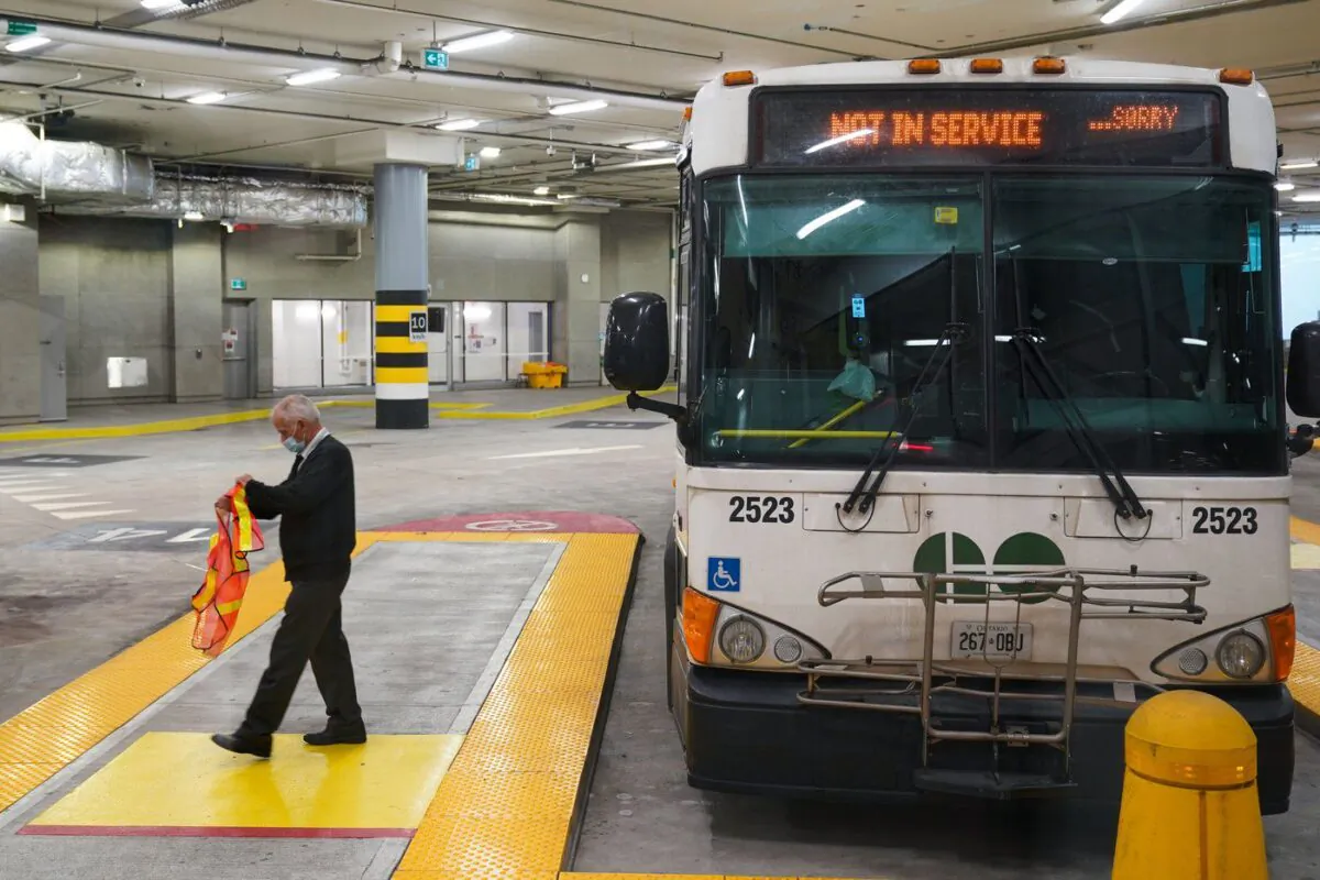 A bus driver disembarks a GO Transit bus at the new Union Station Bus Terminal in Toronto on Nov. 2, 2021. (Evan Buhler/The Canadian Press)