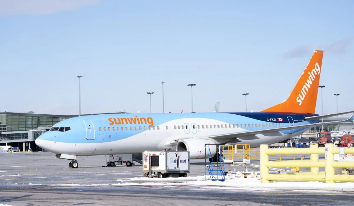 A Sunwing aircraft is parked at Montreal Trudeau airport in Montreal on March 2, 2022. (The Canadian Press/Paul Chiasson)