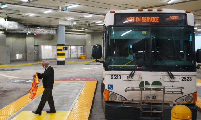 A bus driver disembarks a GO Transit bus at the new Union Station Bus Terminal in Toronto on Nov. 2, 2021. (Evan Buhler/The Canadian Press)