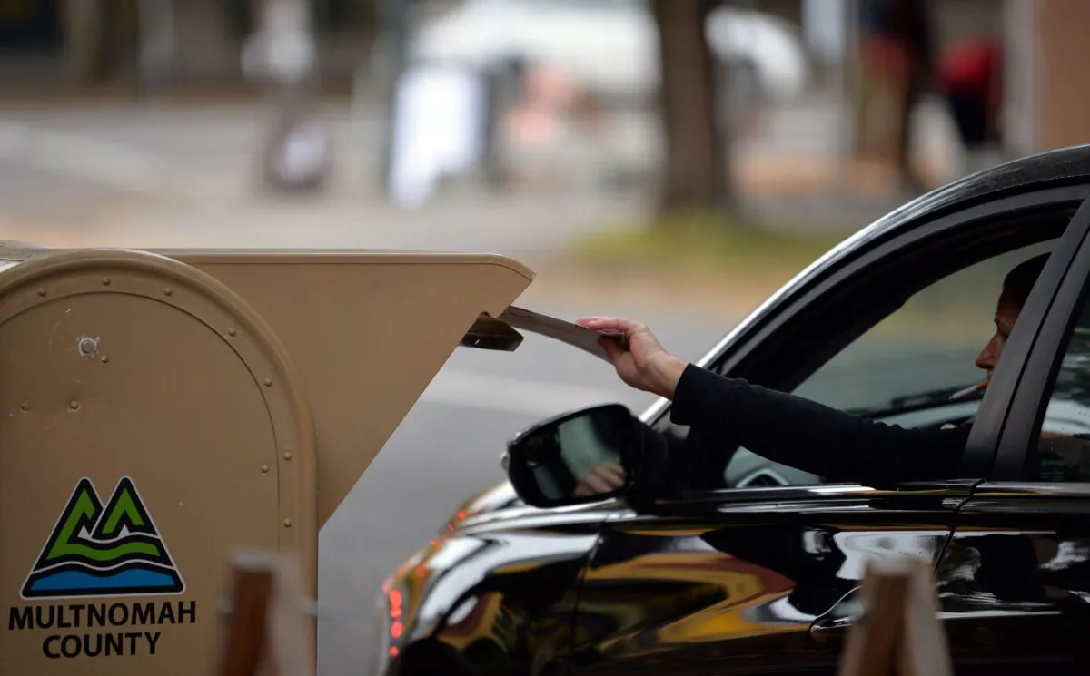 Oregon residents drop off their ballots near the Multnomah County Elections building in Portland, Oregon, on November 3, 2020. (Ankur Dholakia/AFP via Getty Images)