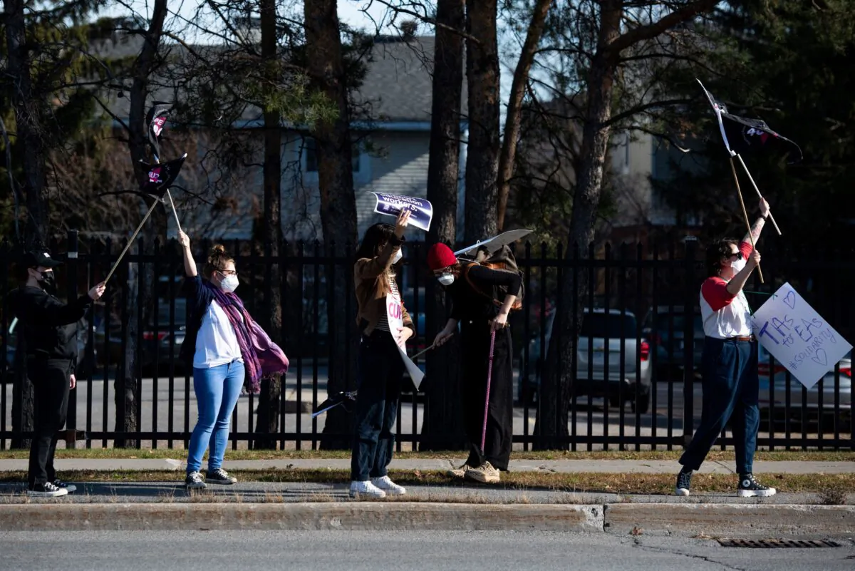 CUPE members and supporters join a demonstration in Ottawa on Nov. 4, 2022. (The Canadian Press/Spencer Colby)