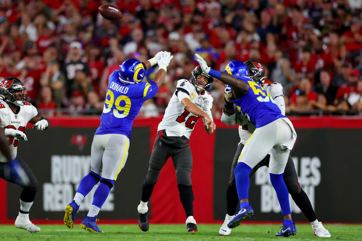 Aaron Donald (99) of the Los Angeles Rams tips a pass from Tom Brady (12) of the Tampa Bay Buccaneers in the fourth quarter at Raymond James Stadium in Tampa, Flor., on Nov. 6, 2022. (Mike Ehrmann/Getty Images)