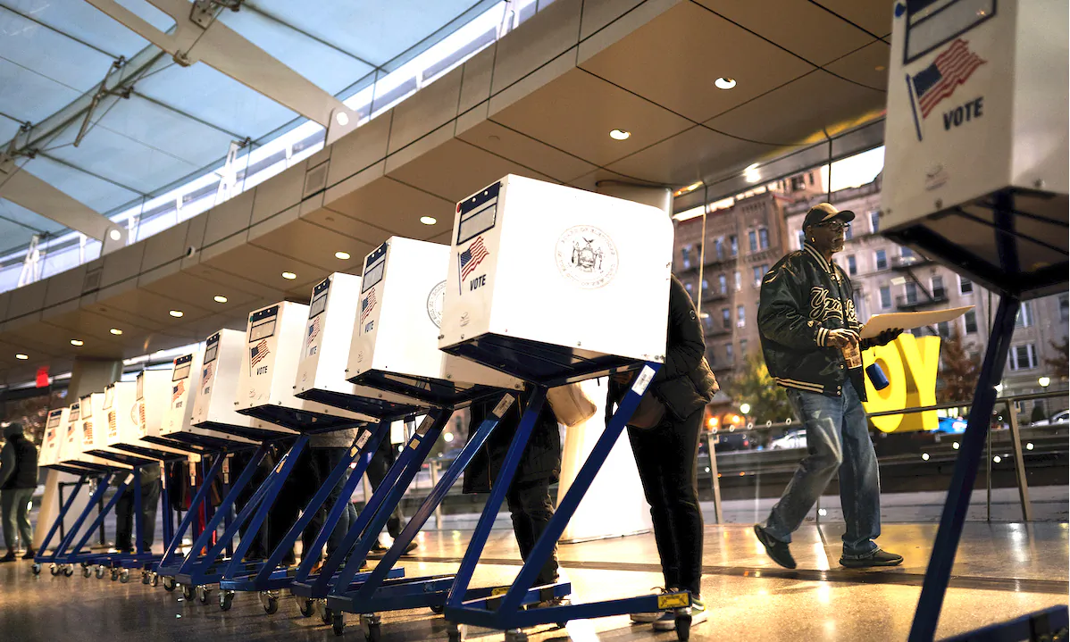 The first voters of the day begin filling out their ballots at a polling site in the Brooklyn Museum as the doors open for the midterm election in the Brooklyn borough of New York on Nov. 8, 2022. (John Minchillo/AP Photo)