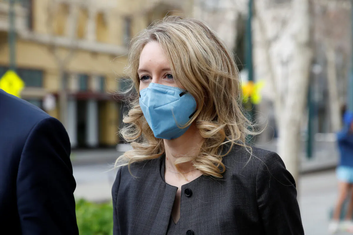 Theranos founder Elizabeth Holmes and her family leave the federal courthouse after attending her fraud trial in San Jose, Calif., on Jan. 3, 2022. (Brittany Hosea-Small/Reuters)