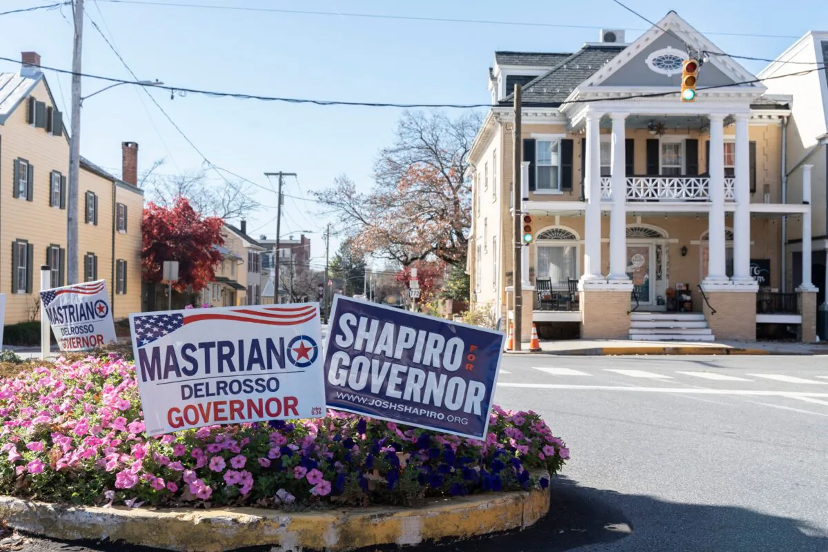 Campaign signs for competing Pennsylvania gubernatorial candidates Doug Mastriano and Josh Shapiro sit in Mannheim, Pa., on Nov. 7, 2022, on the eve of the U.S. midterm elections. (Branden Eastwood/AFP via Getty Images)