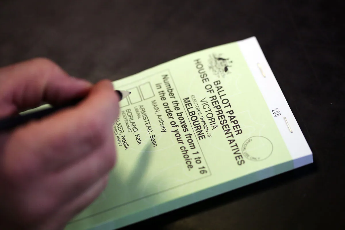 A member of the public votes at Mount Alexander College Polling Booth on election day in Melbourne, Australia, on Sept. 7, 2013. (Photo by Graham Denholm/Getty Images)