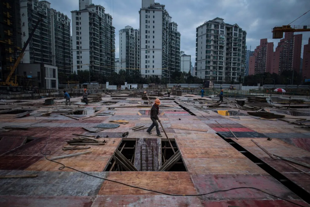 A man works at a construction site of a residential skyscraper in Shanghai, China, on Nov. 29, 2016. (Johannes Eisele/AFP via Getty Images)
