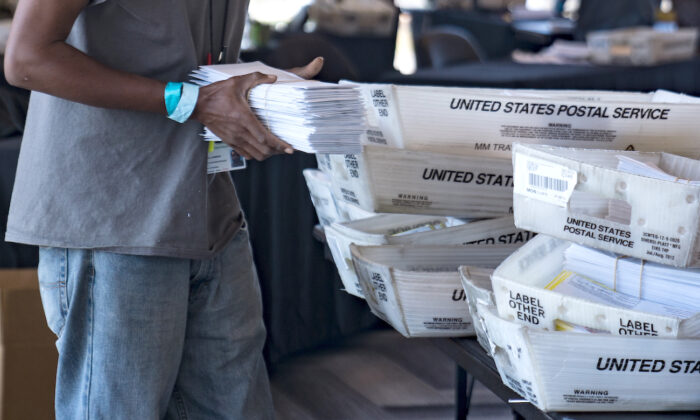 An election worker processes absentee ballots in Atlanta, Ga., on Nov. 2, 2020. (Megan Varner/Getty Images)