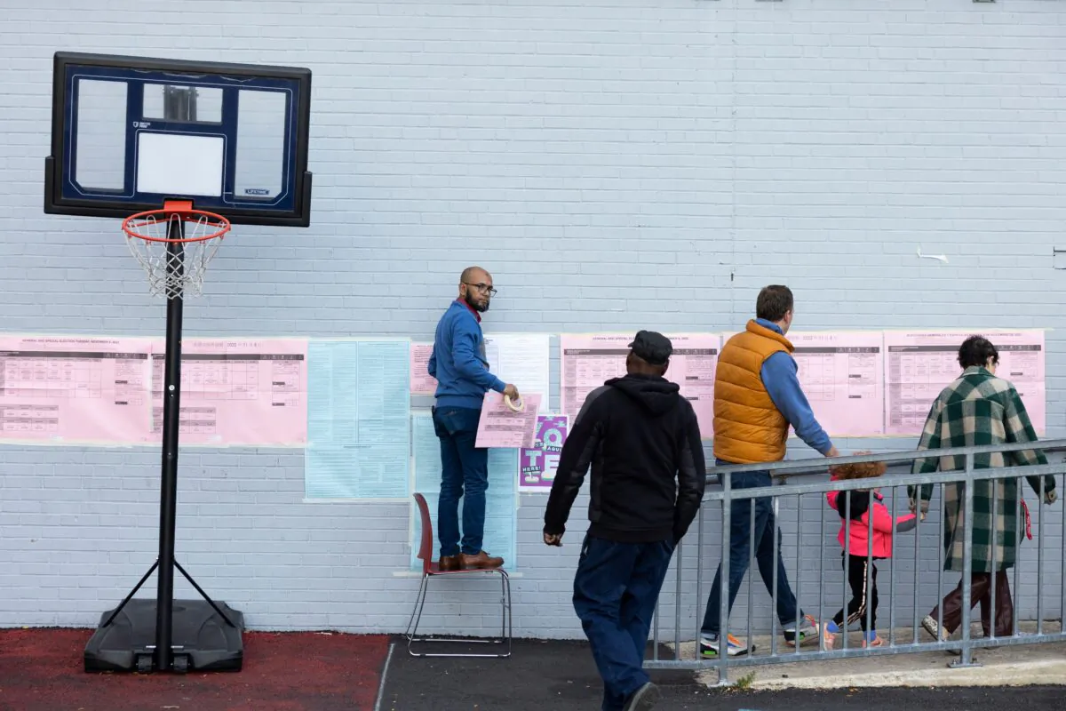 Voters arrive to cast ballots in the midterm election at a polling place in a school in Philadelphia, Pa., on Nov. 8, 2022. (Ryan Collerd/AFP via Getty Images)