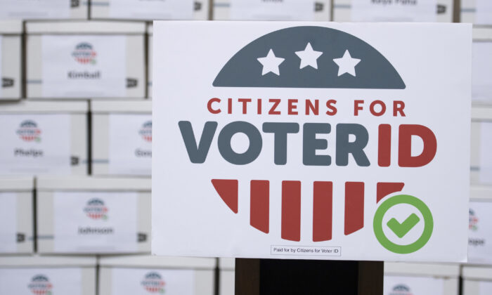 Boxes of signatures are displayed after a news conference hosted by Citizens for Voter ID at the Nebraska Capitol building in Lincoln, Nebraska, on July 7, 2022. (Noah Riffe/Lincoln Journal Star via AP)
