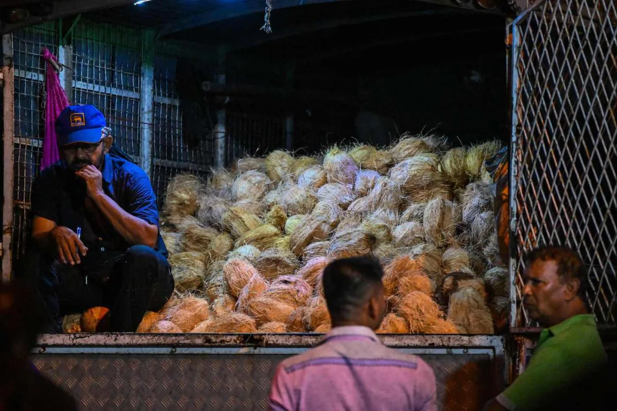 A vendor selling coconuts waits for customers at a night market in Colombo, Sri Lanka on Nov. 8, 2022. (Ishara S. Kodikara/AFP via Getty Images)