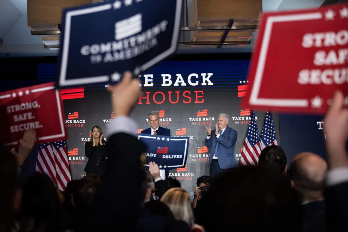 Republican National Committee Chair Ronna McDaniel and Rep. Tom Emmer (R-Minn.) cheer as House Minority Leader Kevin McCarthy (R-Calif.), center, speak at an election night watch party in Washington, D.C., on Nov. 9. (Brendan Smialowski/AFP via Getty Images)