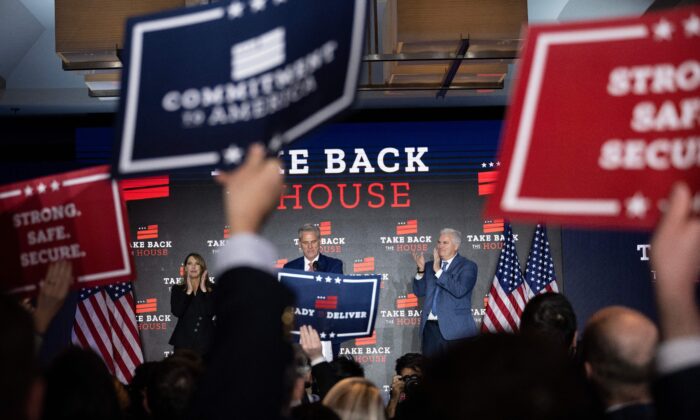 Republican National Committee Chair Ronna McDaniel and Rep. Tom Emmer (R-Minn.) cheer as House Minority Leader Kevin McCarthy (R-Calif.), center, speak at an election night watch party in Washington, D.C., on Nov. 9. (Brendan Smialowski/AFP via Getty Images)
