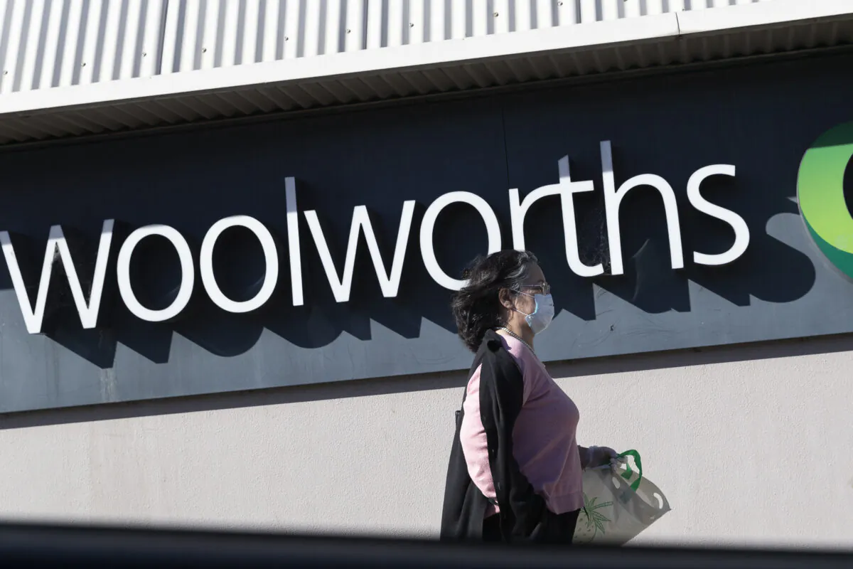 A woman walks past the entrance to the Woolworths Metro supermarket in North Strathfield in Sydney, Australia on Aug. 17, 2020. (Brook Mitchell/Getty Images)