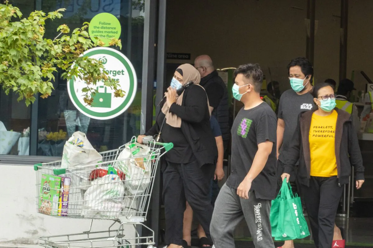 Shoppers are seen wearing masks in a file photo (Jenny Evans/Getty Images)