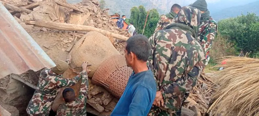 Members of the Nepalese army work during a rescue operation at the ruins of a collapsed house, damaged after an earthquake struck early Wednesday, in the western district of Doti, Nepal on Nov. 9, 2022. (Nepal Army/Handout via Reuters)