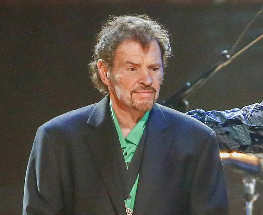 Guitarist and fiddle player Jeff Cook from the band Alabama appears on stage at the concert "Sing me Back Home: The Music of Merle Haggard" in Nashville, Tenn., on April 6, 2017. (Al Wagner/Invision/AP)