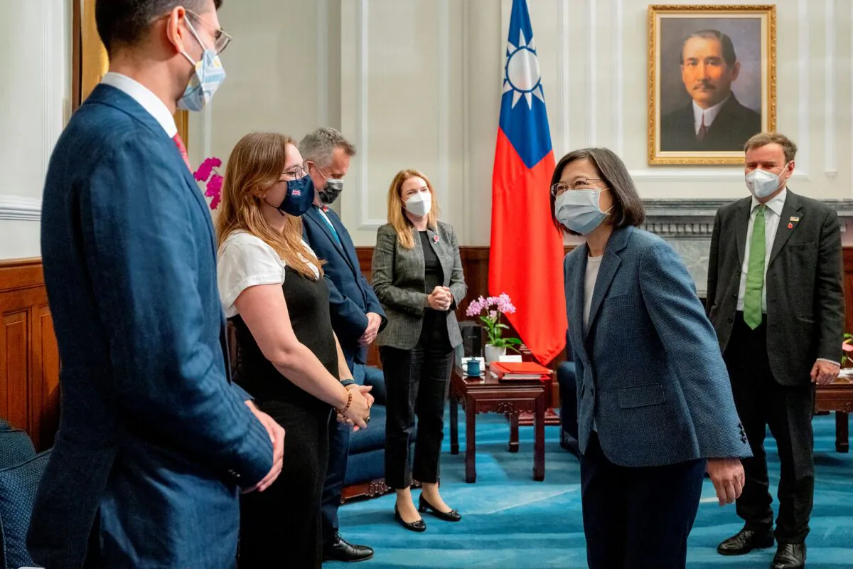 Taiwan's President Tsai Ing-wen greets other members of the delegation led by visiting British Trade Minister Greg Hands (R) at the Presidential Office in Taipei, Taiwan, on Nov. 9, 2022. (Taiwan Presidential Office via AP)