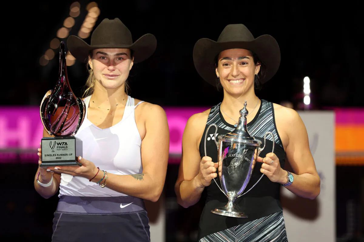 (L-R) Aryna Sabalenka of Belarus and Caroline Garcia of France pose with their trophies after their Women's Singles Final match during the 2022 WTA Finals, part of the Hologic WTA Tour, at Dickies Arena in Fort Worth, Tex., on Nov. 7, 2022. (Tom Pennington/Getty Images)