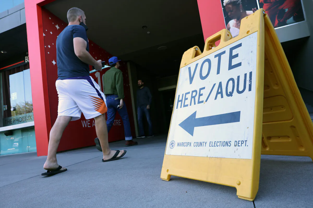 Voters arrive to cast their ballots at the Phoenix Art Museum in Phoenix, Ariz., on Nov. 8, 2022. (Kevin Dietsch/Getty Images)
