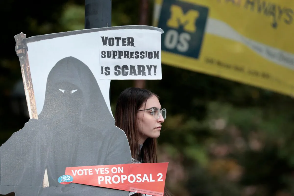 A supporter of a Michigan pro-abortion proposal stands in Ann Arbor, Mich., on Oct. 3, 2022. (Jeff Kowalsky/AFP via Getty Images)