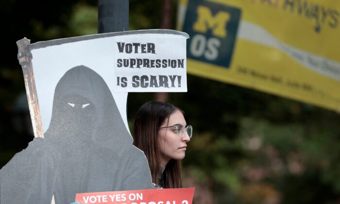 A supporter of a Michigan pro-abortion proposal stands in Ann Arbor, Mich., on Oct. 3, 2022. (Jeff Kowalsky/AFP via Getty Images)