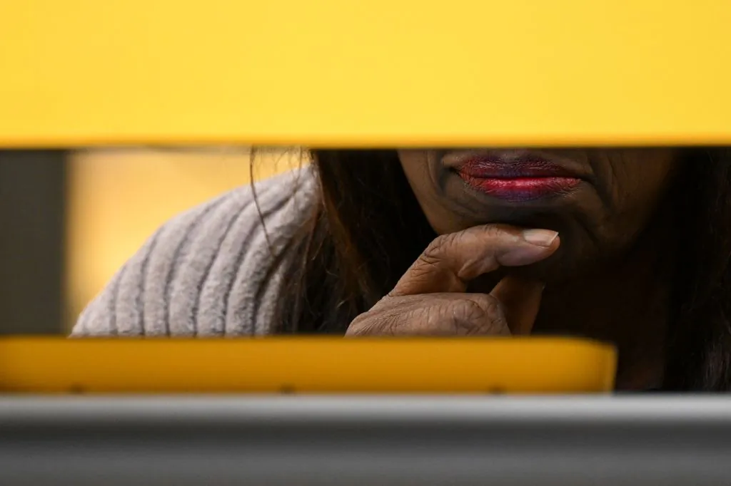 A voter casts their ballot for the US midterm election, inside a voting center at Crenshaw High School in Los Angeles on Nov. 8, 2022. (Patrick T. Fallon/AFP via Getty Images)