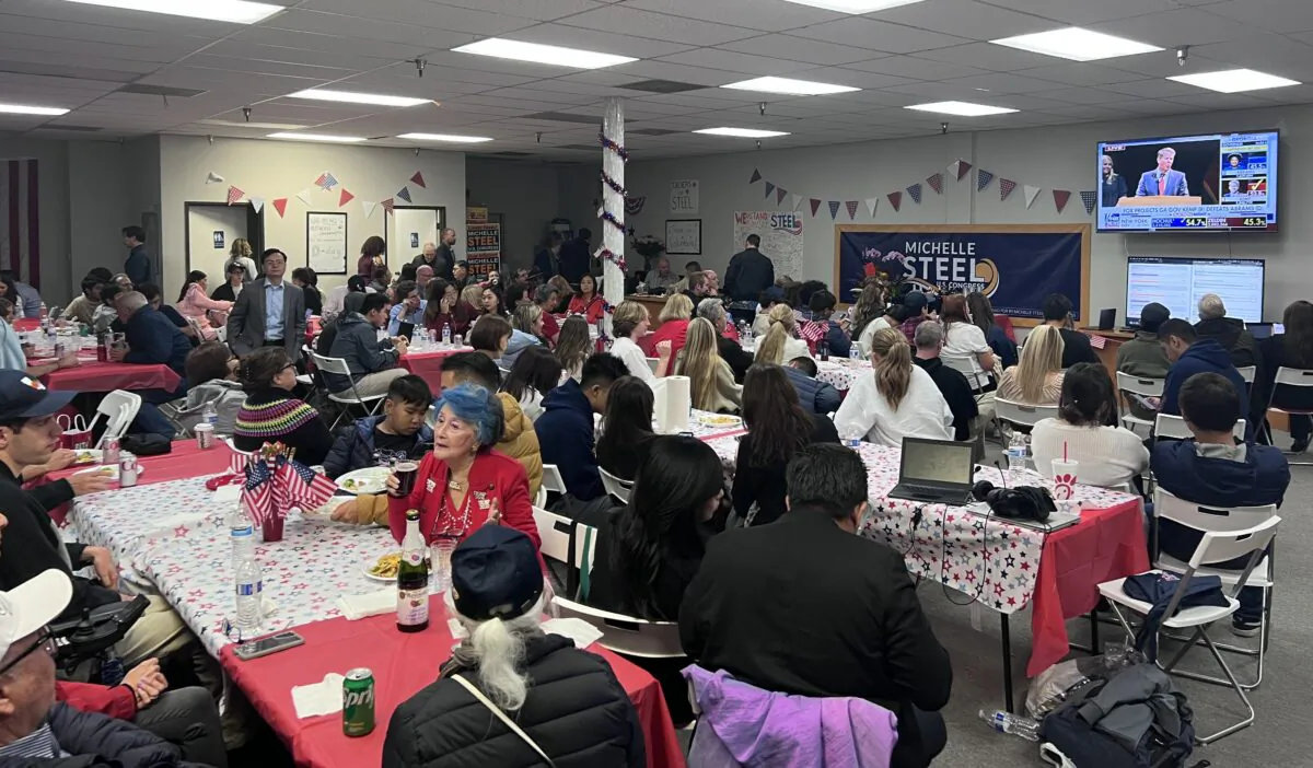 Over 50 people gather to monitor the preliminary results of the election at a retail office in support of 45th District Congressional Republican candidate Rep. Michelle Steel in Buena Park, Calif., on Nov. 8, 2022. (Rudy Blalock/The Epoch Times)