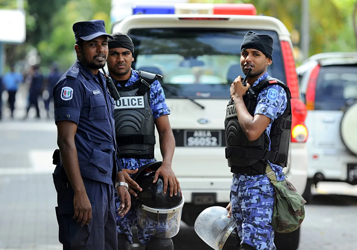 Maldives police stand guard on Oct. 19, 2013. (Ishara S.Kodikara/AFP via Getty Images)