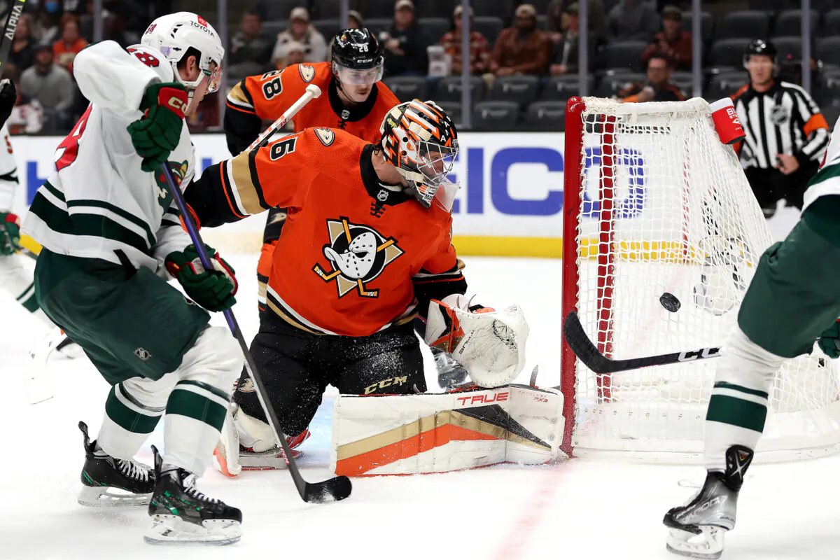 Mason Shaw (58) of the Minnesota Wild shoots the puck as John Gibson (36) of the Anaheim Ducks defends during the first period of a game at the Honda Center in Anaheim, Calif., on Nov. 9, 2022. (Sean M. Haffey/Getty Images)