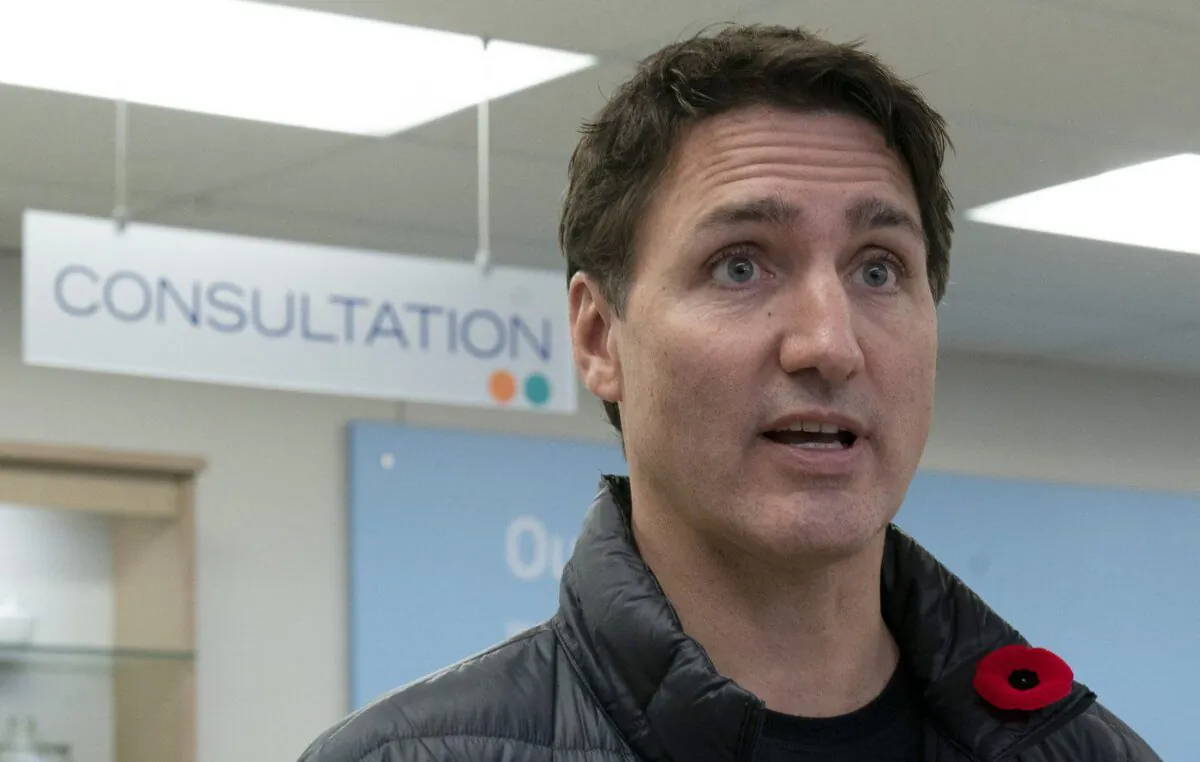 Prime Minister Justin Trudeau answers a question on health care after receiving vaccinations at a pharmacy, in Ottawa, Nov. 9, 2022. (The Canadian Press/Adrian Wyld)
