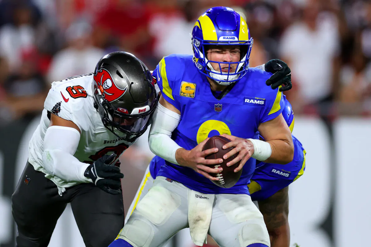 Matthew Stafford (9) of the Los Angeles Rams is pressured by Joe Tryon-Shoyinka (9) of the Tampa Bay Buccaneers in the fourth quarter at Raymond James Stadium in Tampa, on Nov. 6, 2022. (Mike Ehrmann/Getty Images)