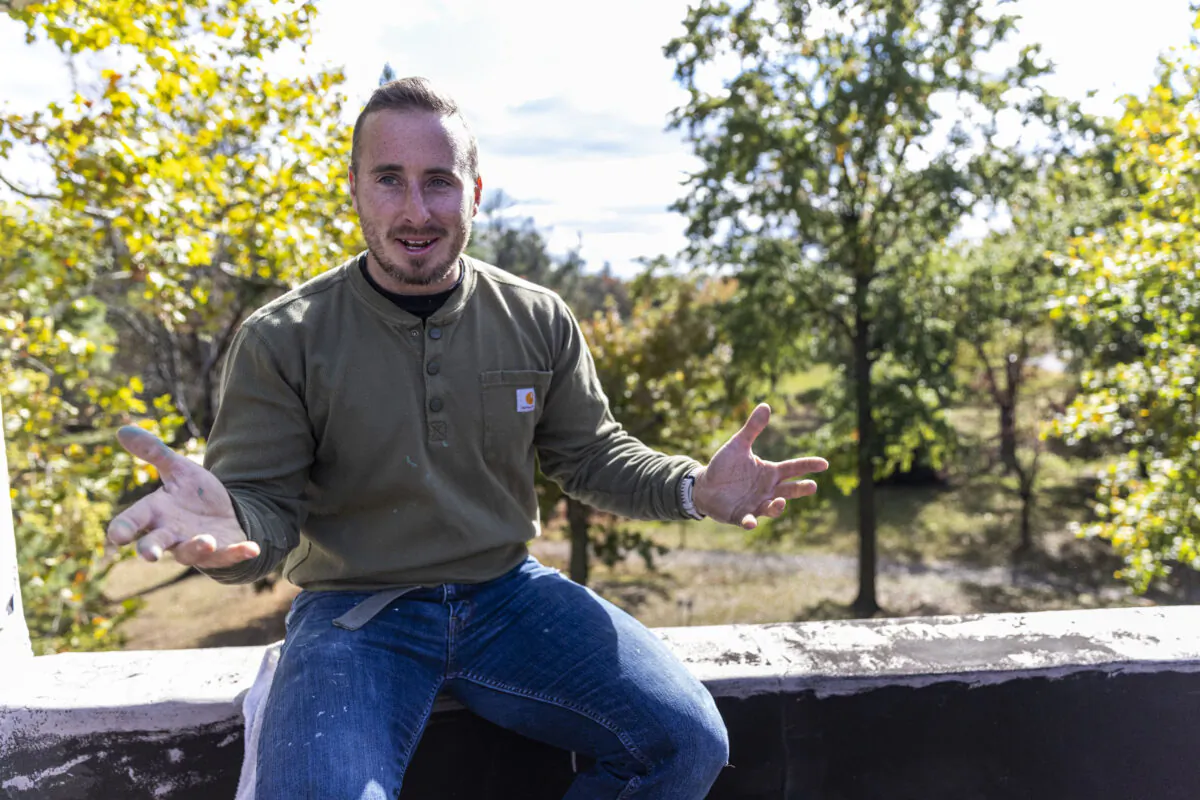 Sean O’Donnell, resident caretaker and restorer of the Knight Park House in Collingswood, New Jersey, on the rooftop, where a viewing space called a belvedere was removed years ago. He hopes to build a new one. (Tyger Williams/The Philadelphia Inquirer/TNS)