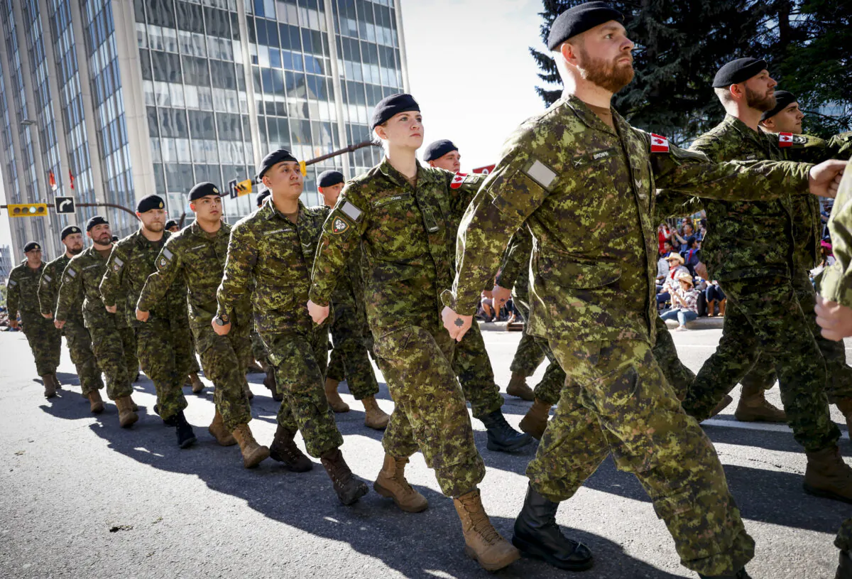 Canadian Forces soldiers march during the Calgary Stampede parade in Calgary, Alta., on July 8, 2022. (The Canadian Press/Jeff McIntosh)