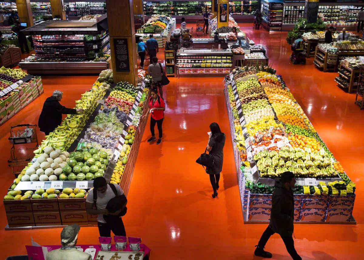 People shop at a grocery store in Toronto in a file photo. (The Canadian Press/Nathan Denette)